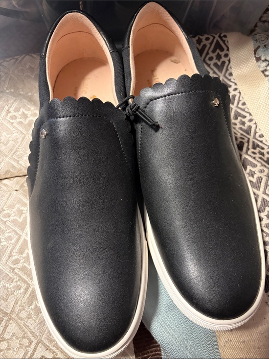kate spade Shoes - Kate Spade Black Scalloped Slip-On Sneakers